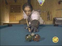 Merrick plays pool with his animal crystals
